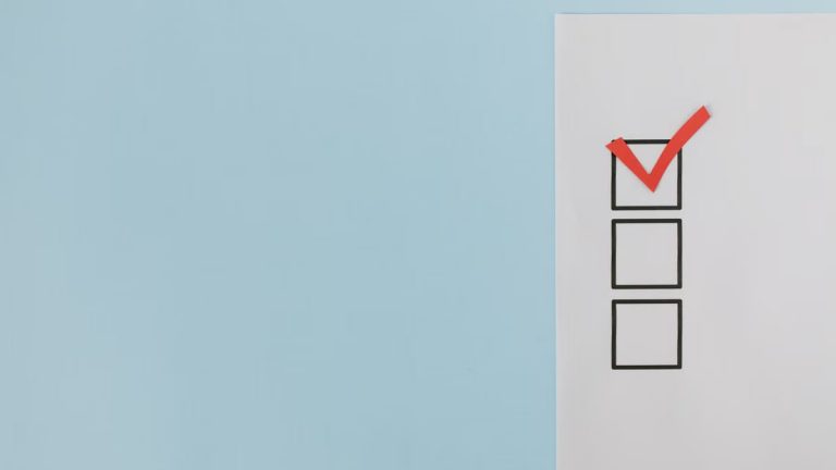 A minimalist checklist with a red checkmark on a blue background, providing ample copy space.